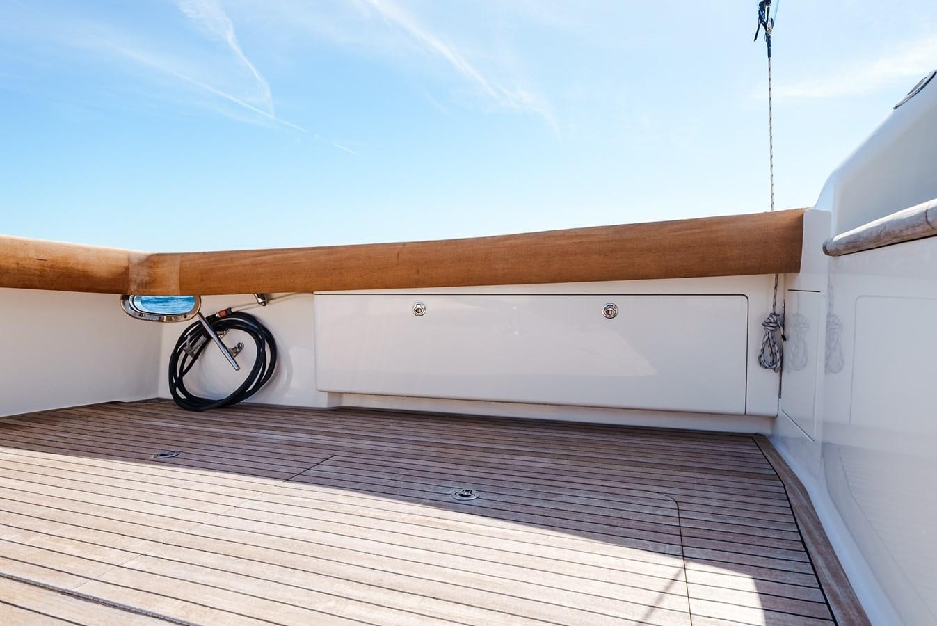 a wooden object on a wooden surface aboard PANACEA Yacht for Sale