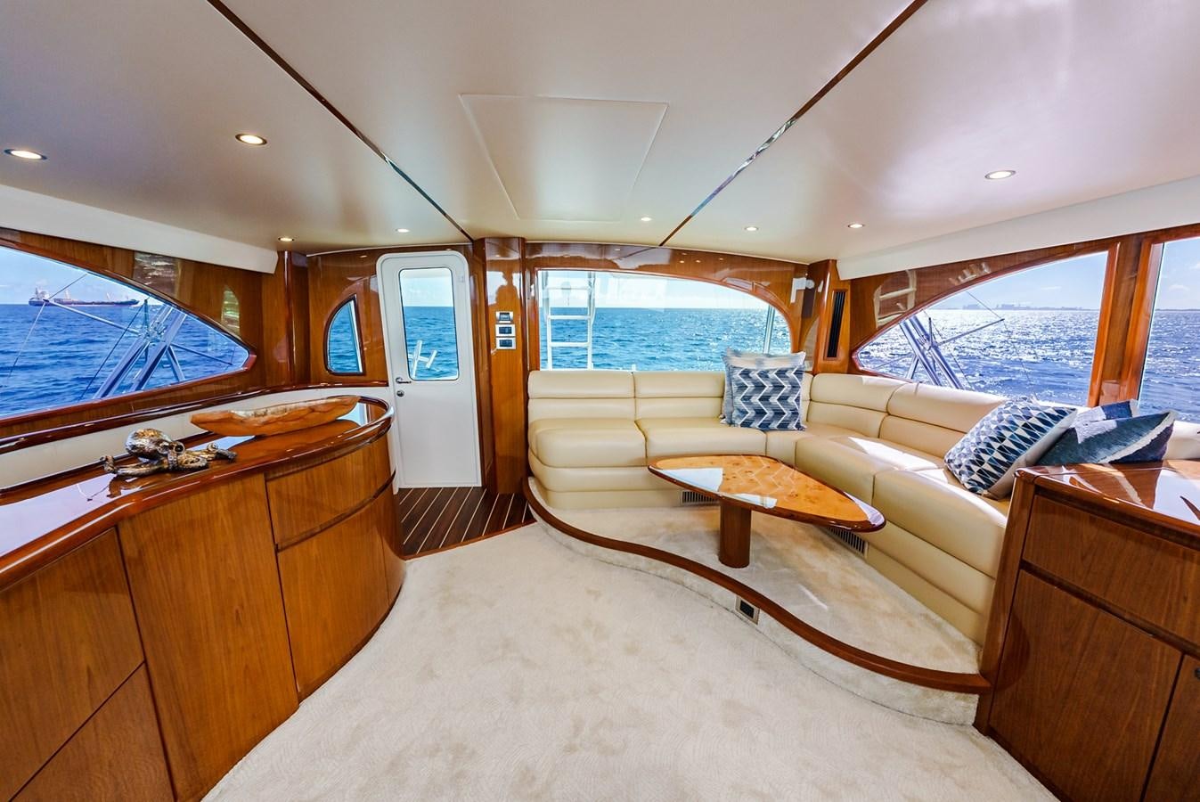 a living room with a couch and a table aboard PANACEA Yacht for Sale