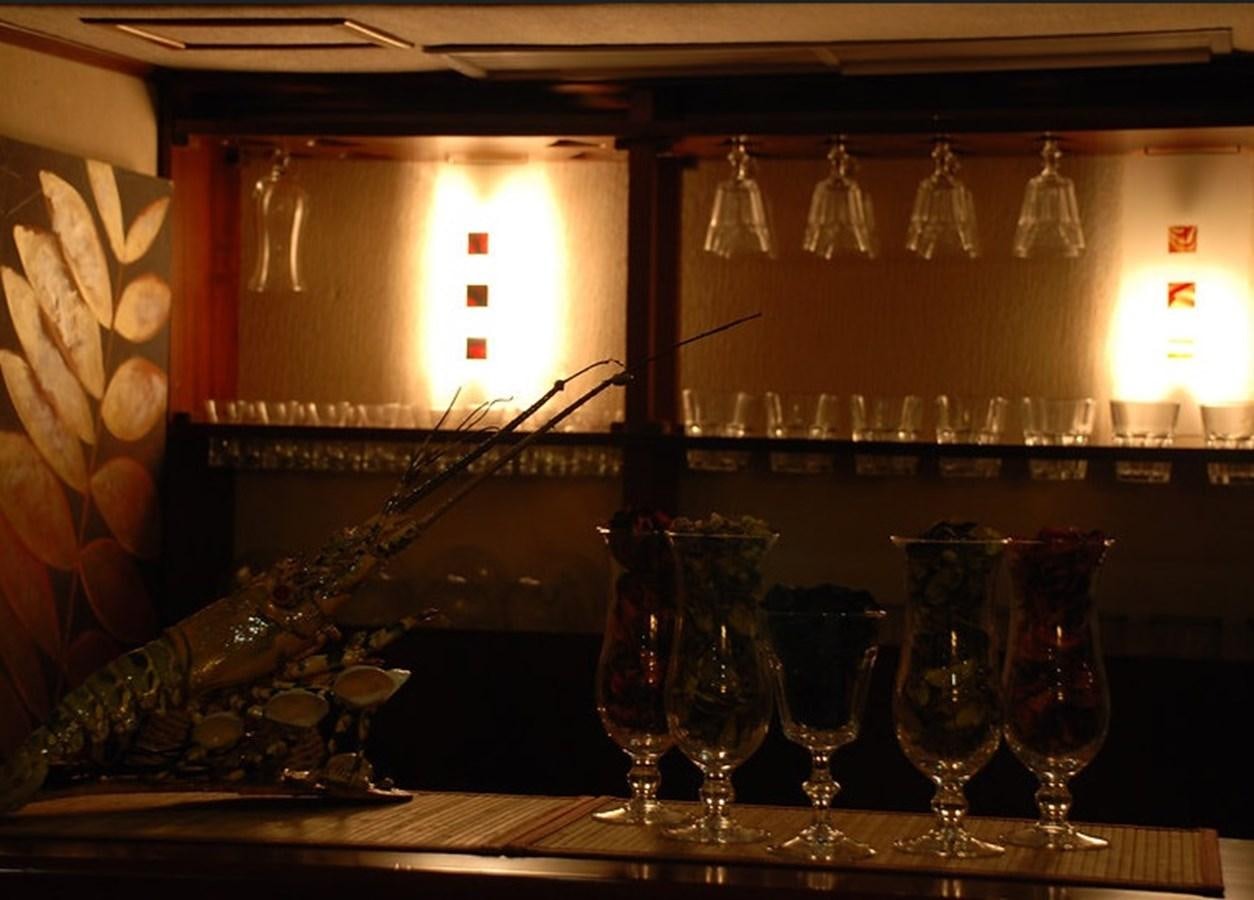 a bar with many glasses and a window aboard 36 M YATCH Yacht for Sale