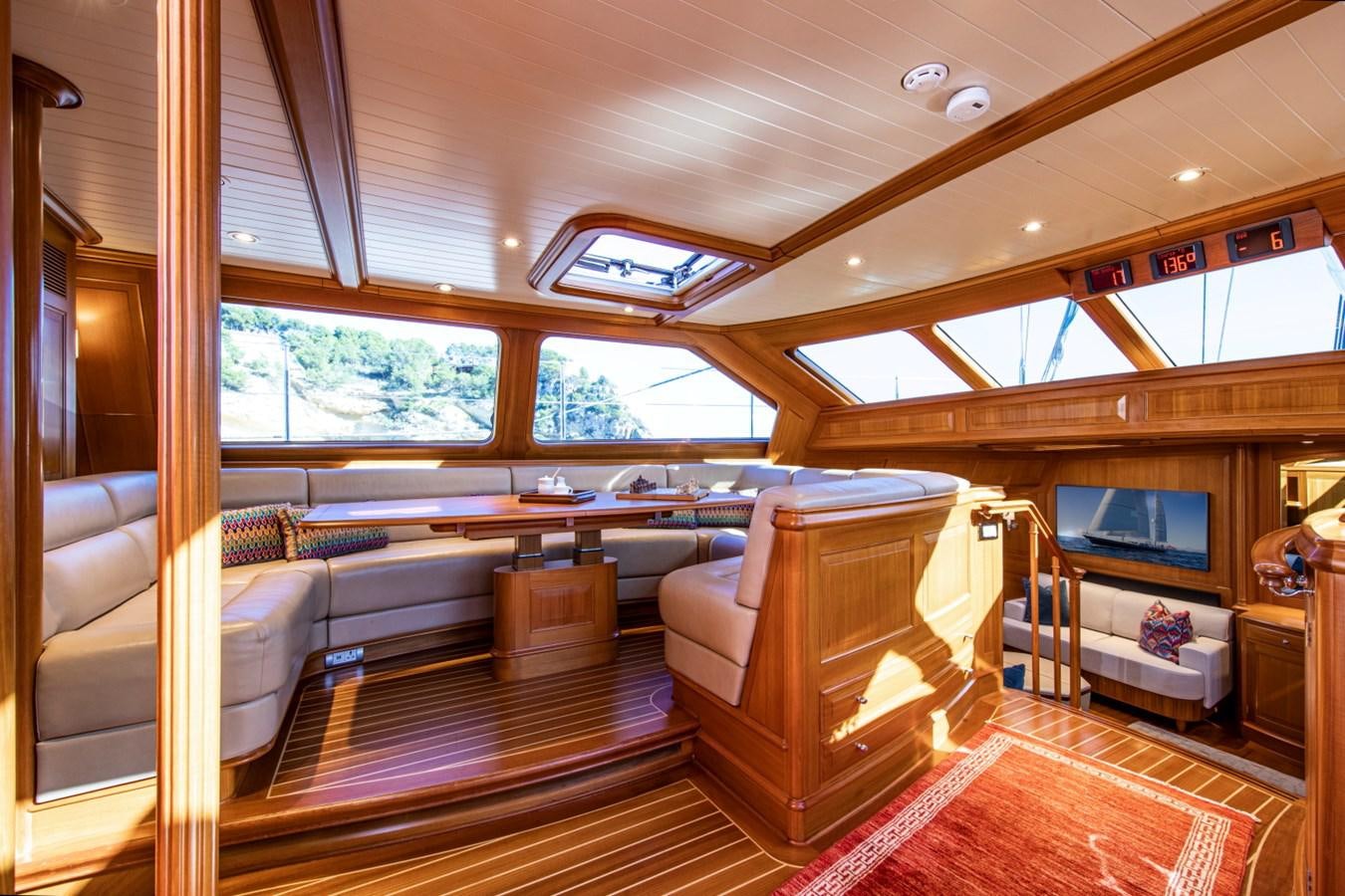 a room with a wood floor and a wood floor and a large window aboard LEGEND Yacht for Sale
