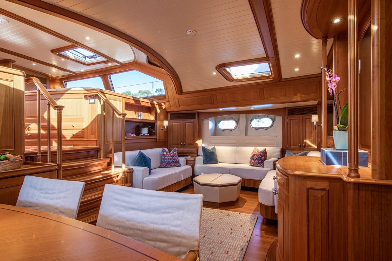 a living room with a wood ceiling aboard LEGEND Yacht for Sale