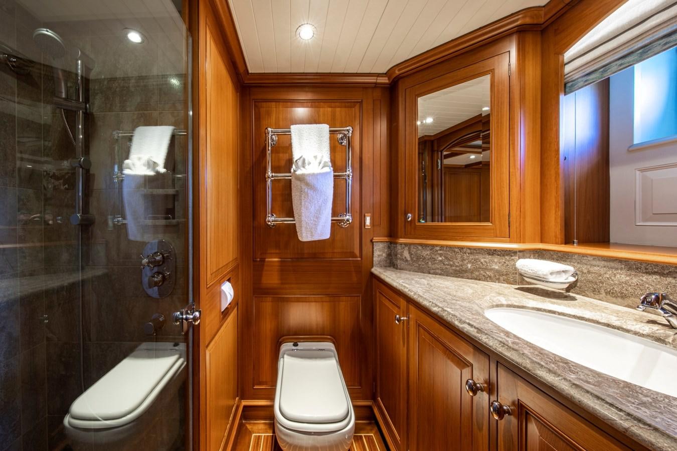 a bathroom with a sink and a toilet aboard LEGEND Yacht for Sale