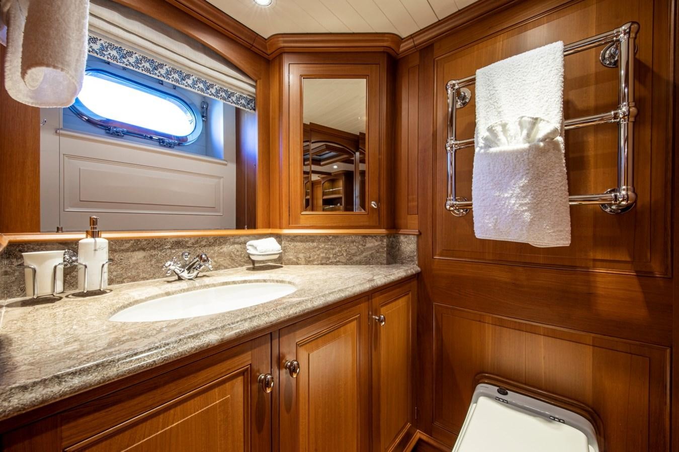a bathroom with a sink and a mirror aboard LEGEND Yacht for Sale