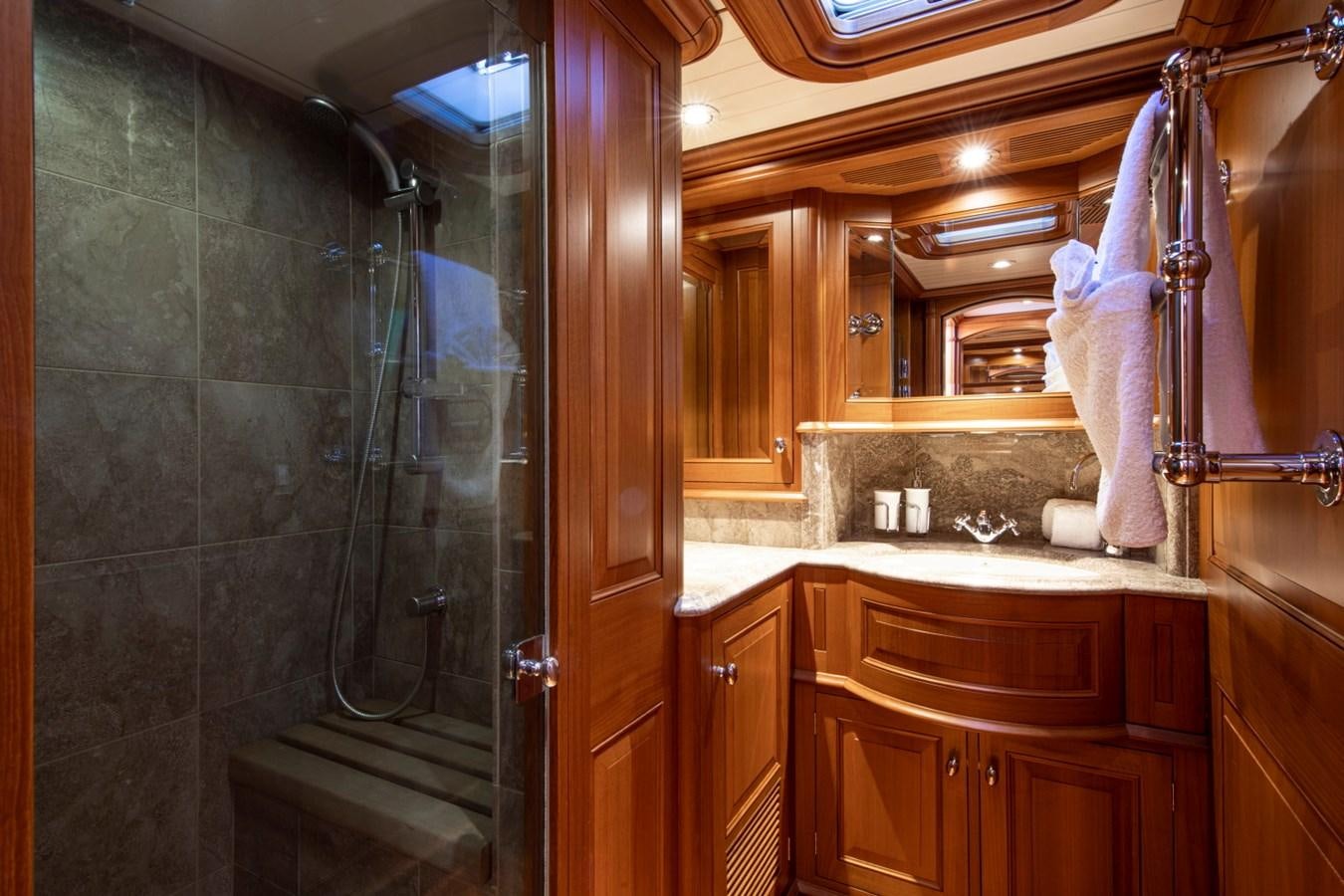 a bathroom with a glass shower aboard LEGEND Yacht for Sale