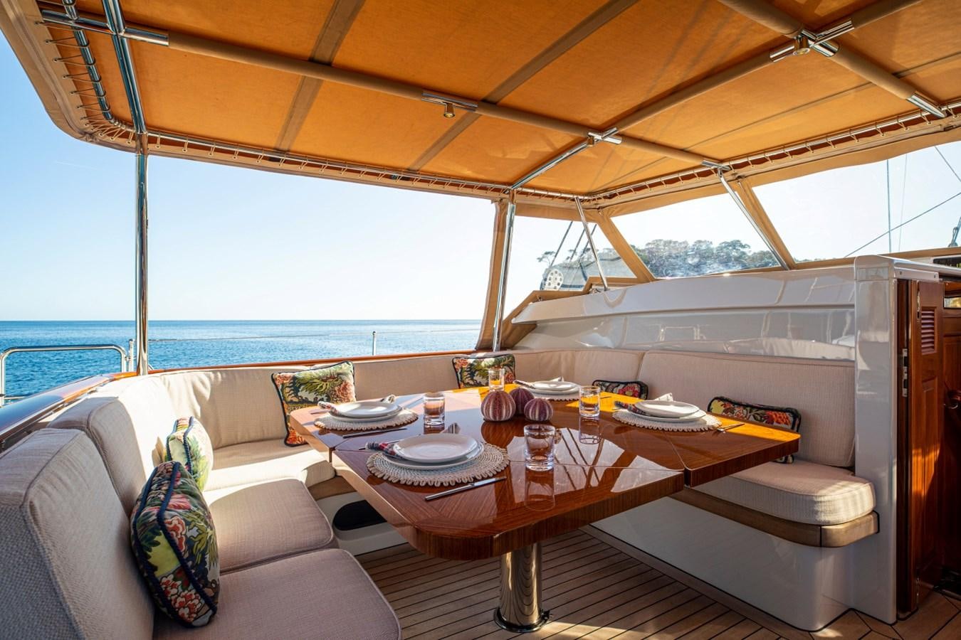 a table and chairs in a room aboard LEGEND Yacht for Sale