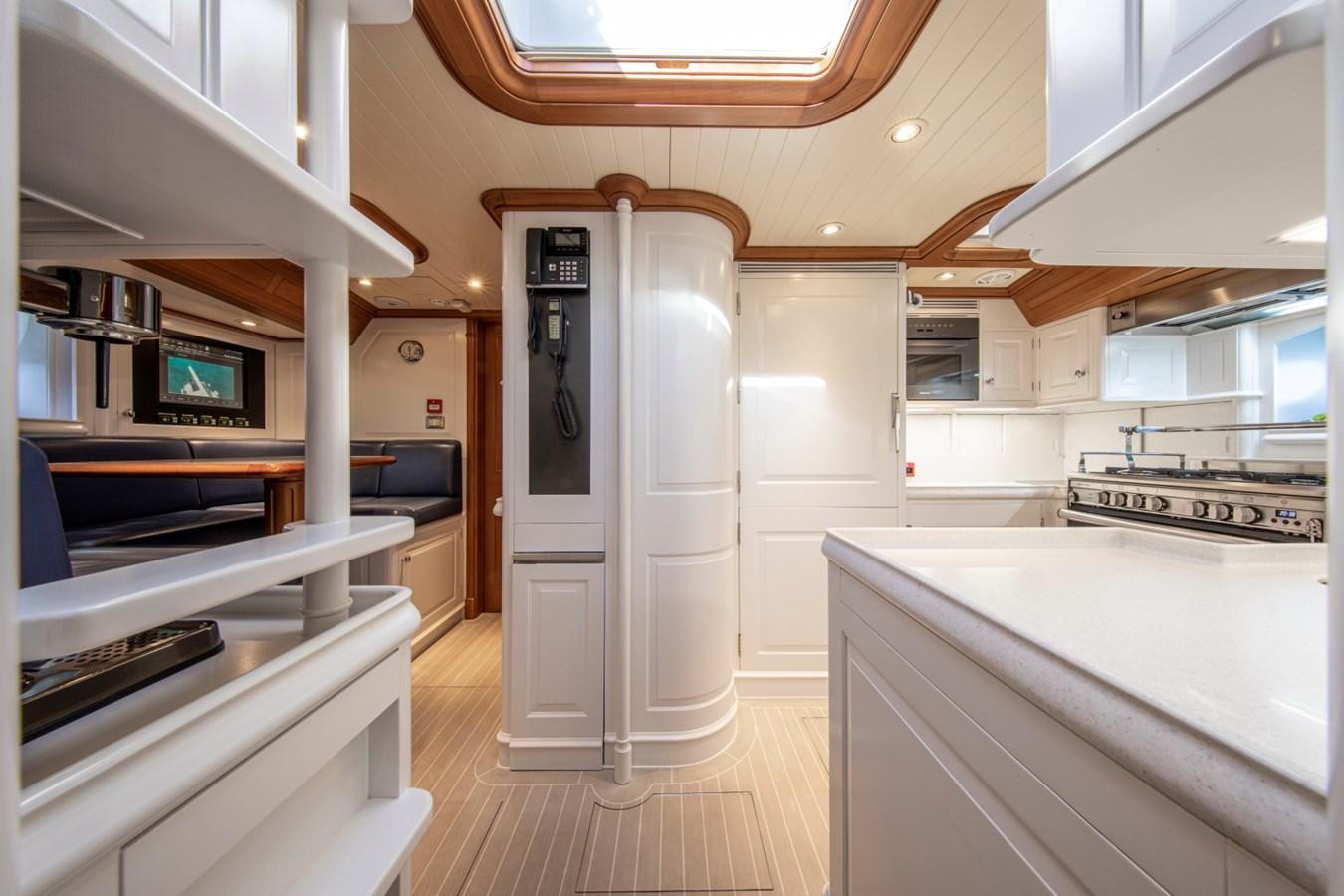 a room with a large white refrigerator aboard LEGEND Yacht for Sale