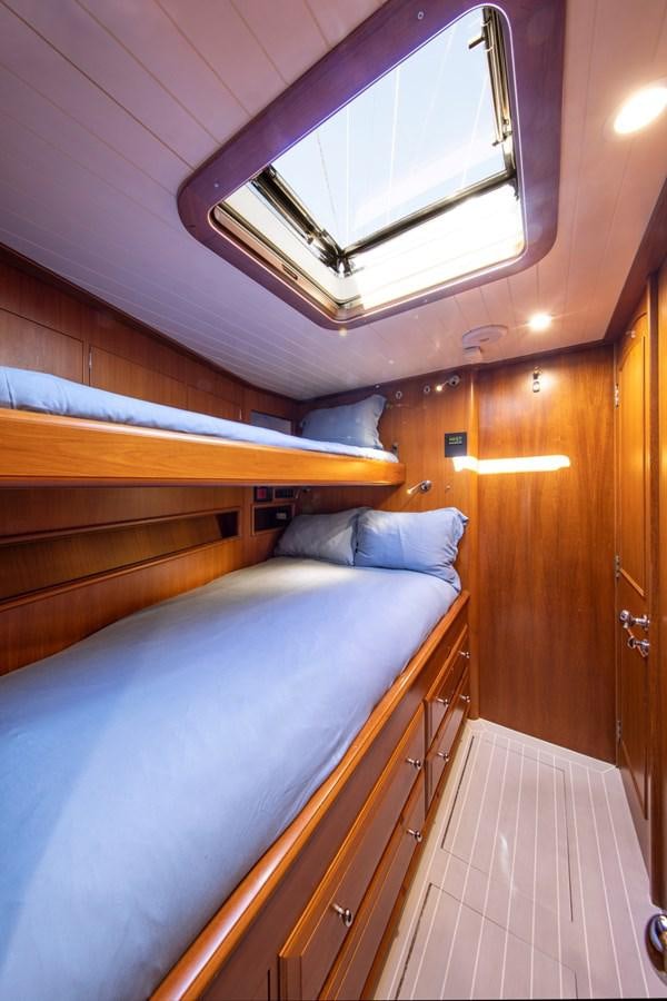 a room with bunk beds aboard LEGEND Yacht for Sale