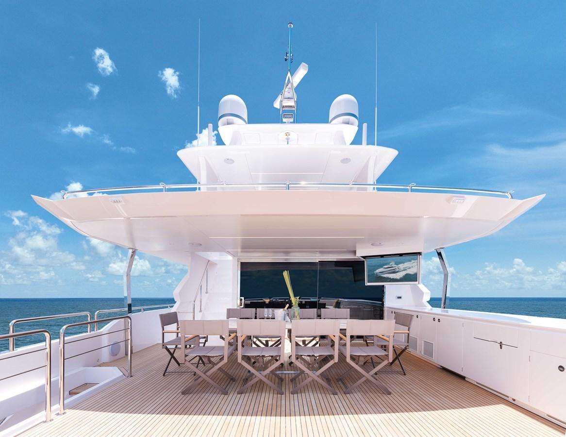 a large white ship with chairs around it aboard HORIZON FD100/911 Yacht for Sale