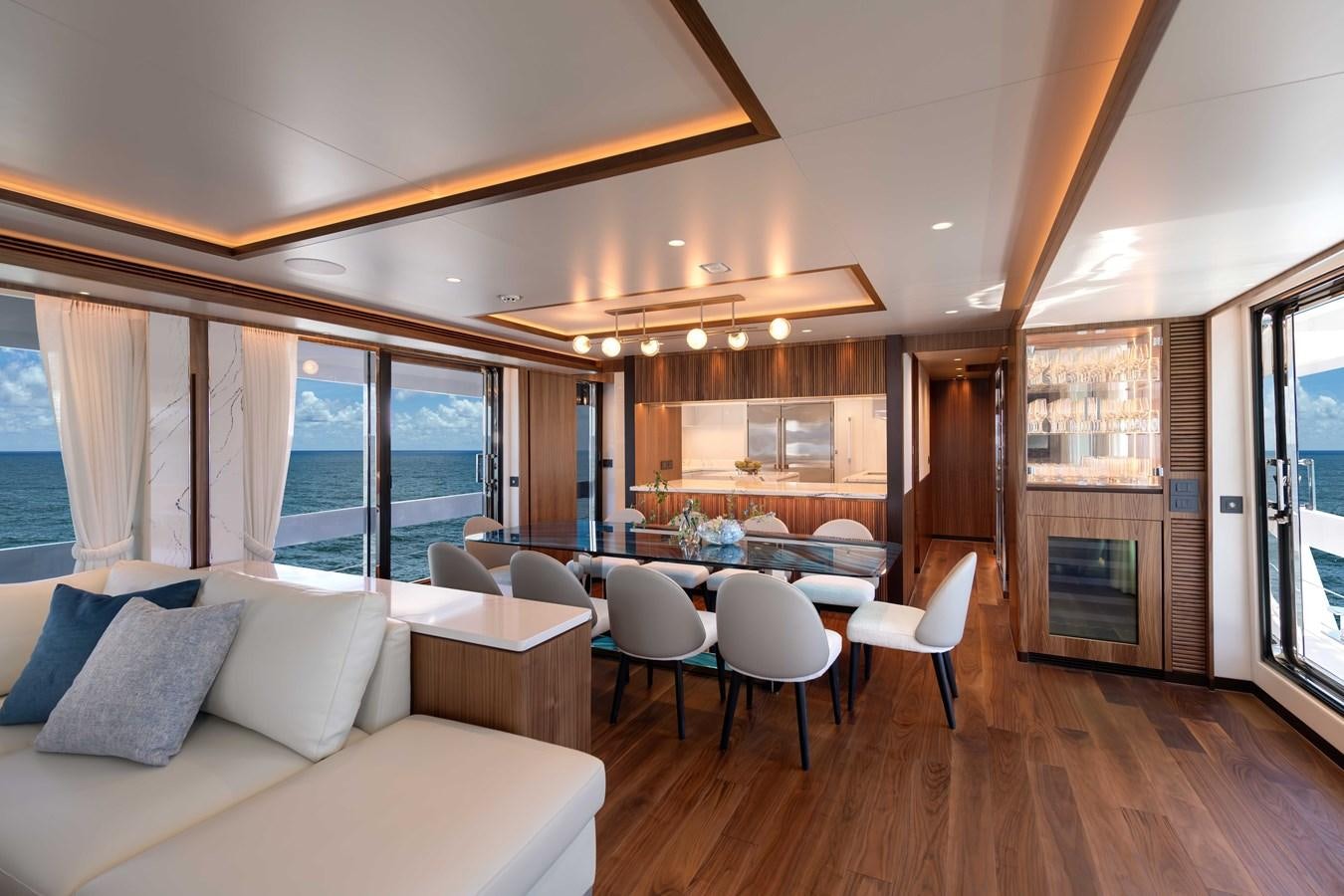 a living room with a large open window aboard HORIZON FD100/911 Yacht for Sale