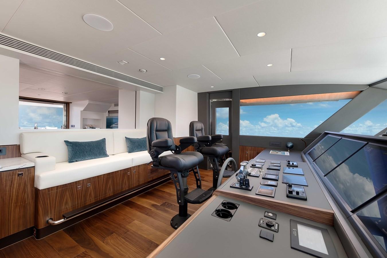 a room with a bed and a tv aboard HORIZON FD100/911 Yacht for Sale