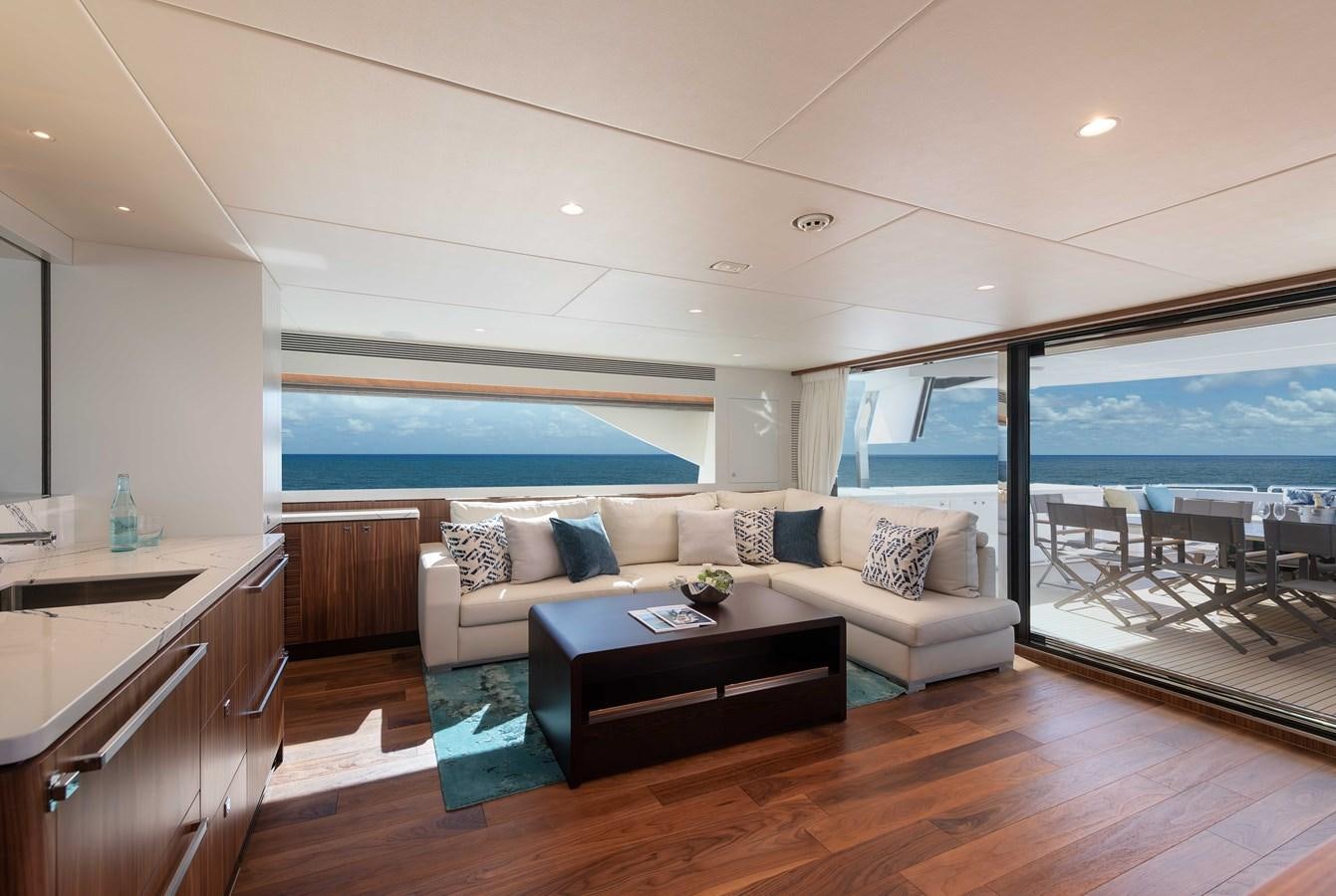 a living room with a large window aboard HORIZON FD100/911 Yacht for Sale