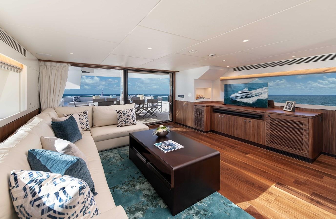 a living room with a large window aboard HORIZON FD100/911 Yacht for Sale