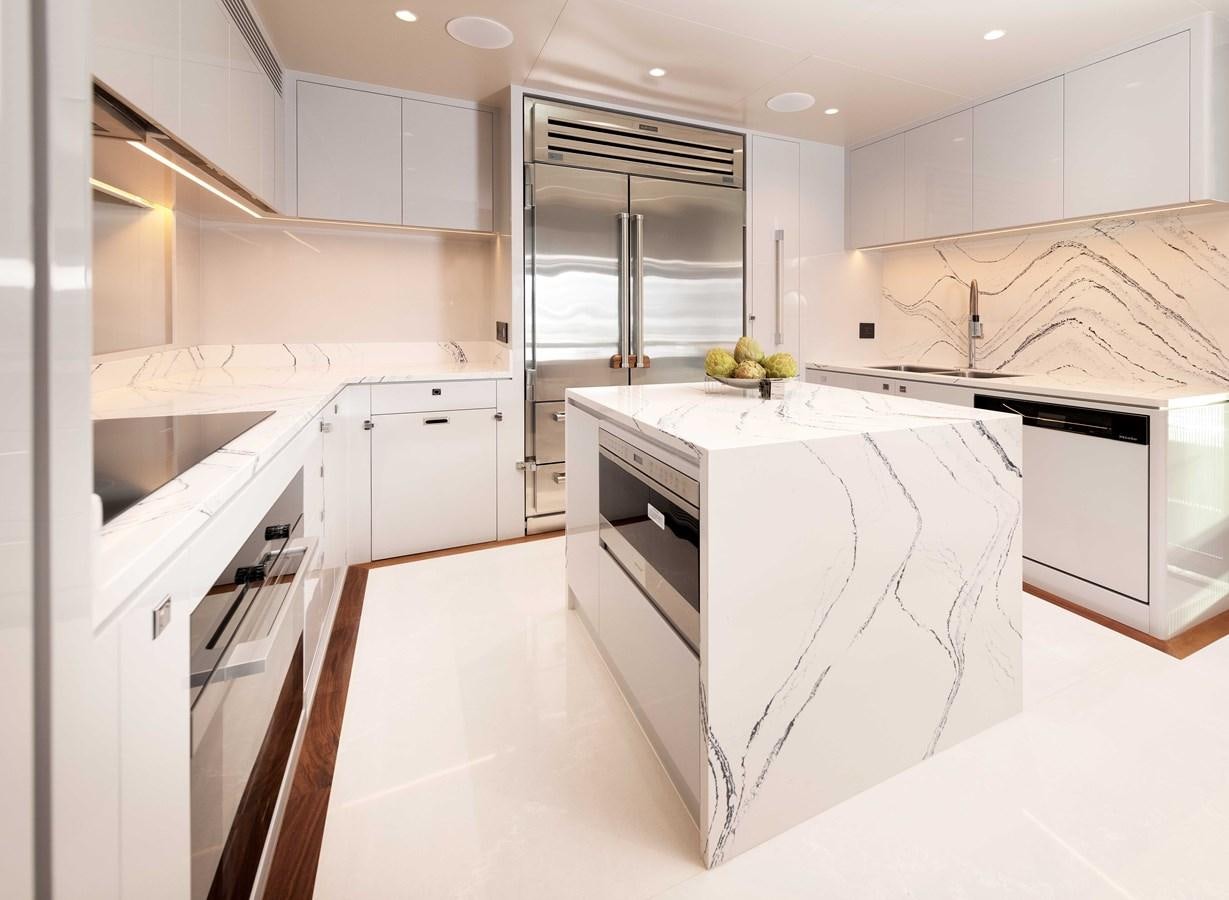 a kitchen with white cabinets aboard HORIZON FD100/911 Yacht for Sale