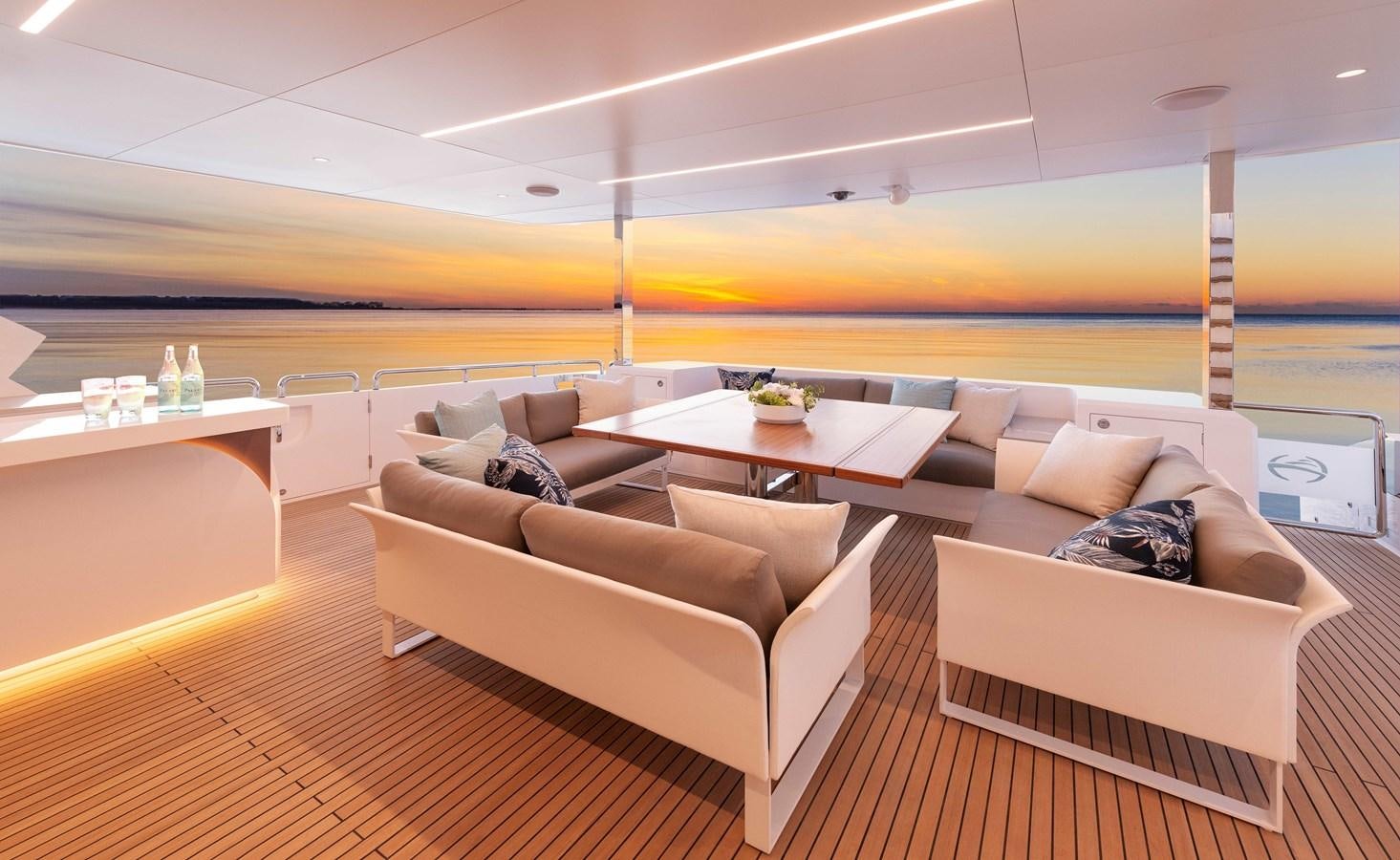 a room with couches and tables aboard HORIZON FD100/911 Yacht for Sale