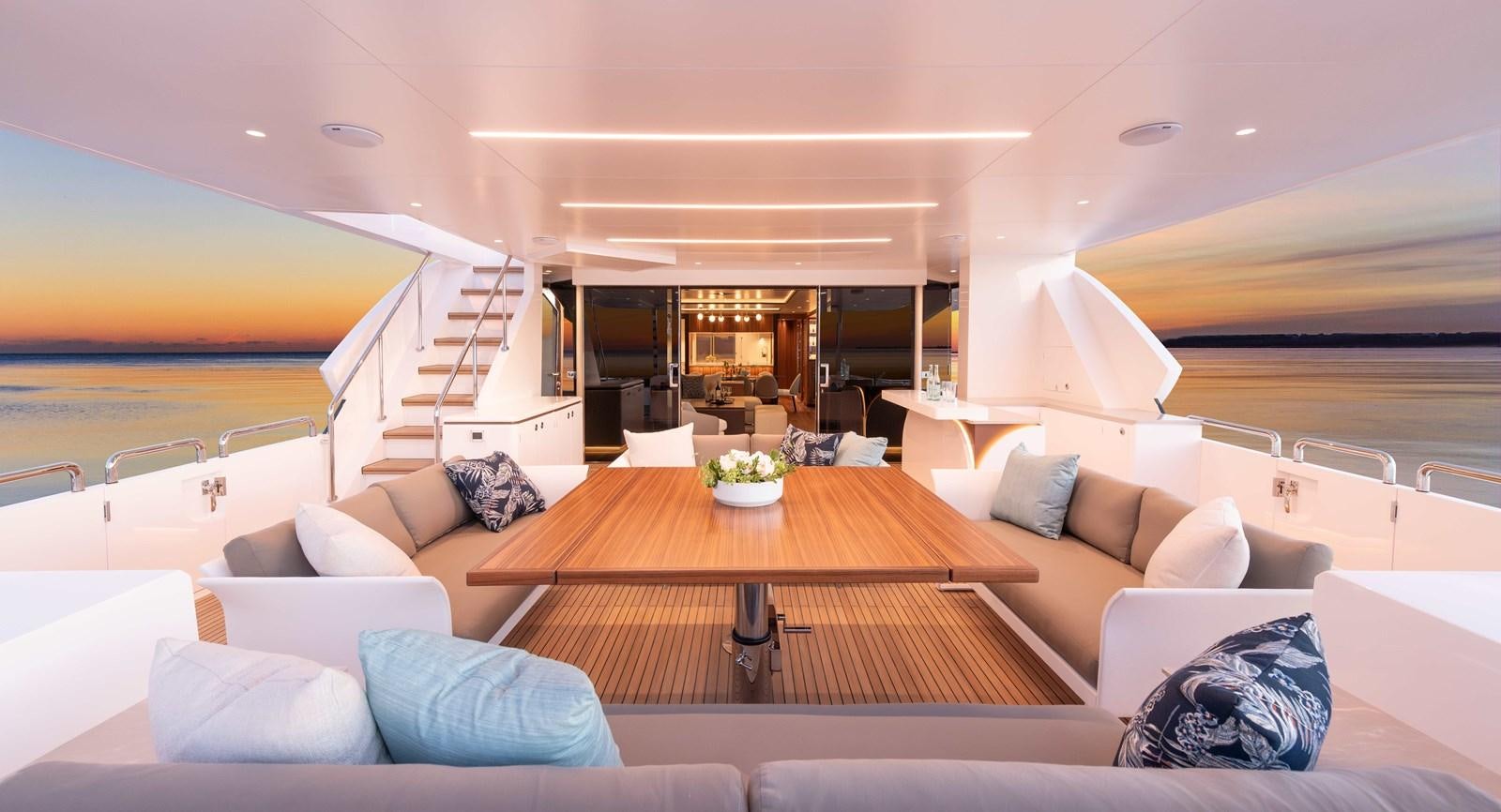 a living room with a large open door aboard HORIZON FD100/911 Yacht for Sale