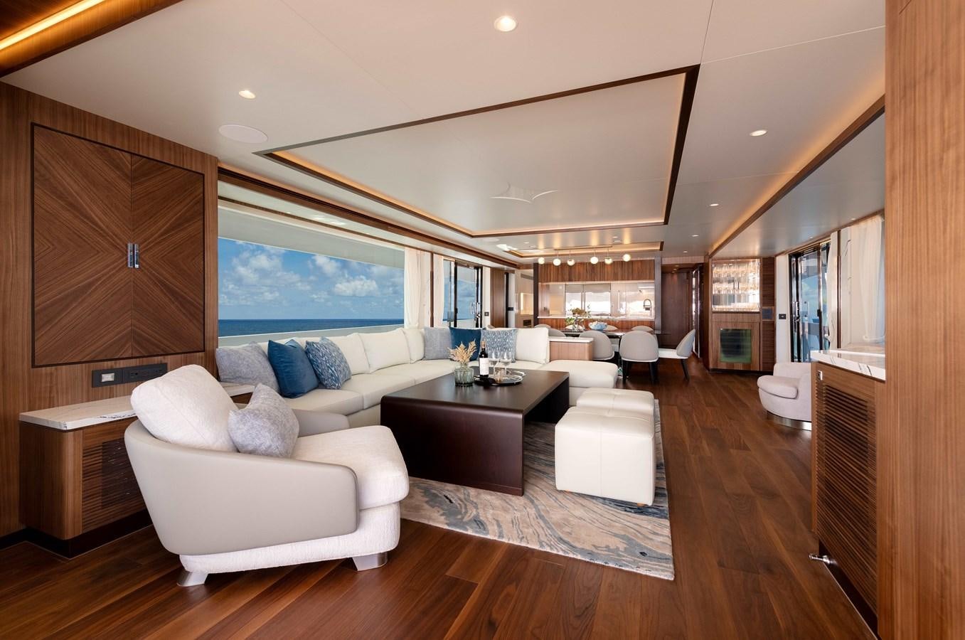 a living room with a large window aboard HORIZON FD100/911 Yacht for Sale