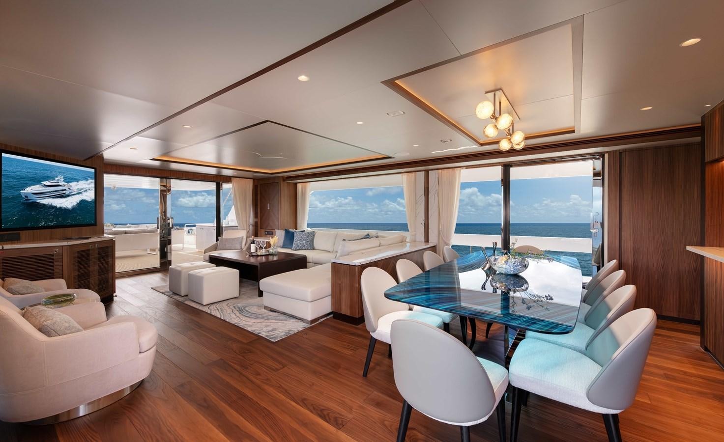 a living room with a large table and chairs aboard HORIZON FD100/911 Yacht for Sale