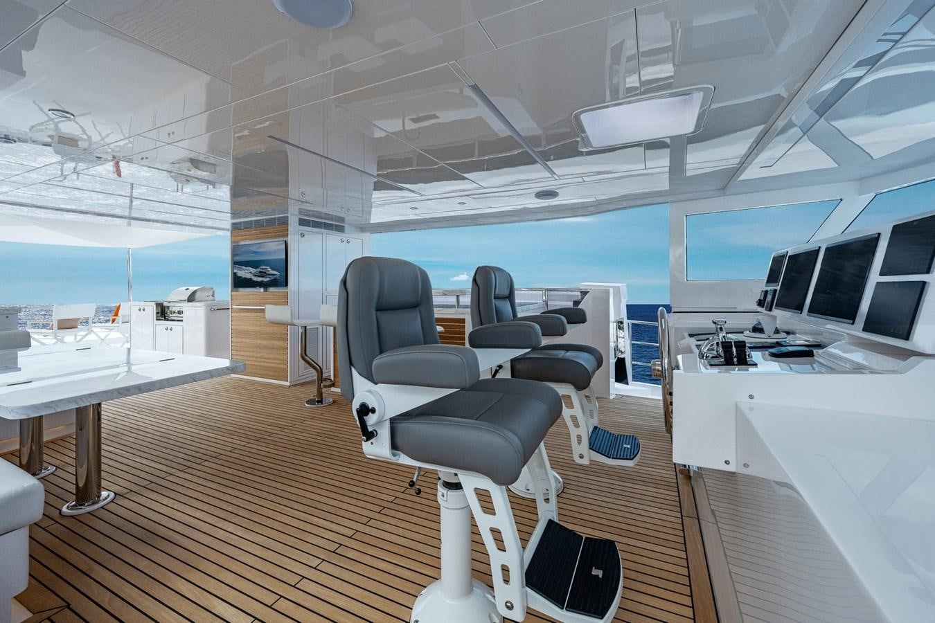 a room with a desk and chairs aboard FD75-709 / NOW AVAILABLE Yacht for Sale