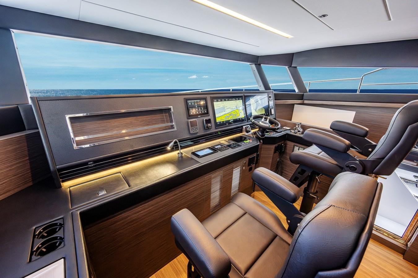 inside of a vehicle with a large screen and a large window aboard FD75-709 / NOW AVAILABLE Yacht for Sale