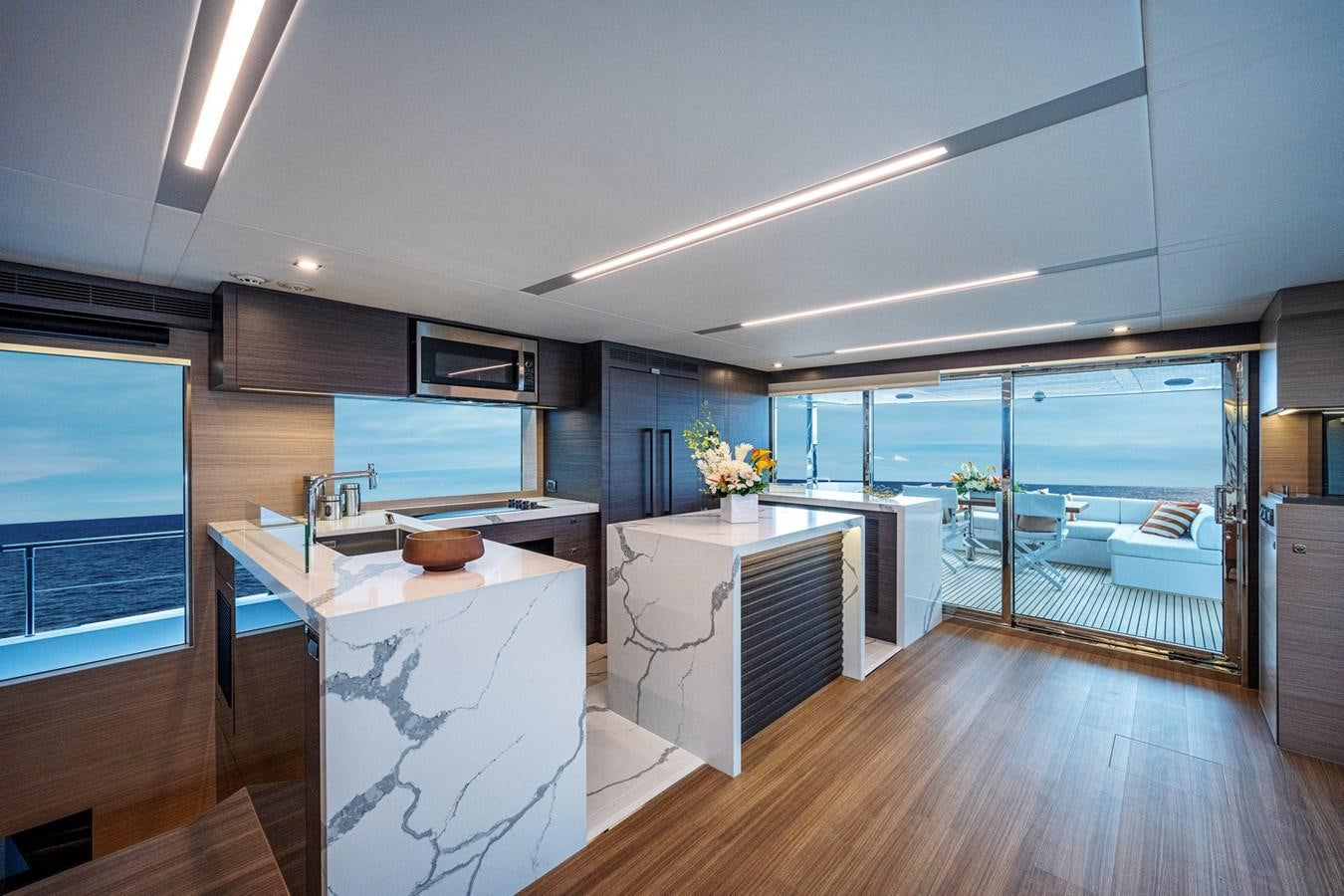 a modern looking kitchen with a large glass door aboard FD75-709 / NOW AVAILABLE Yacht for Sale