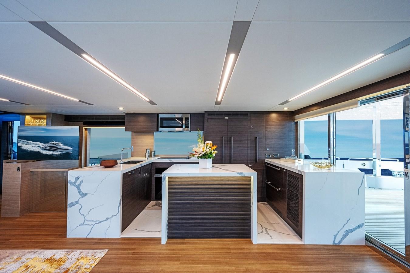 a modern kitchen with a large island aboard FD75-709 / NOW AVAILABLE Yacht for Sale