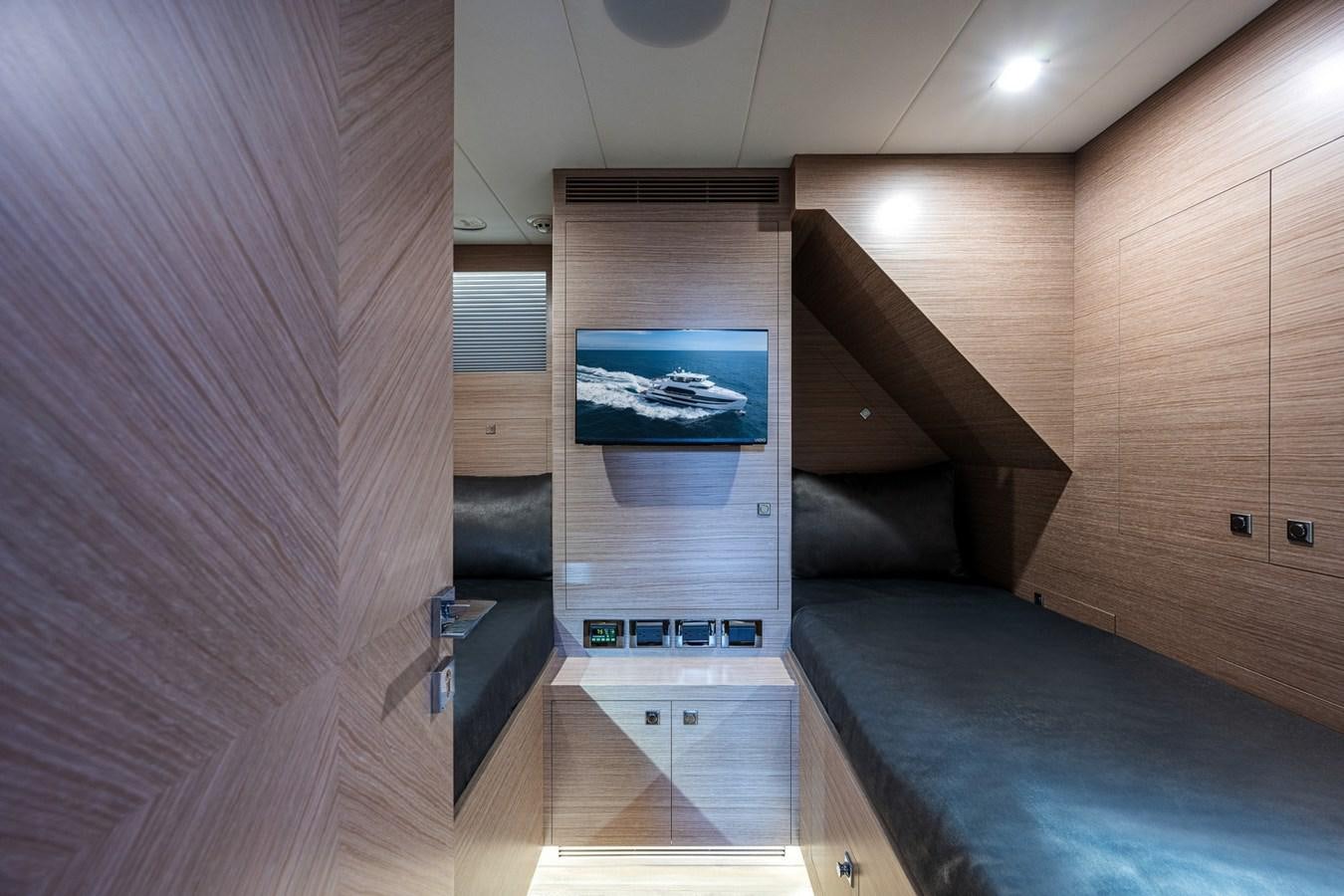 a room with a bed and a tv on the wall aboard FD75-709 / NOW AVAILABLE Yacht for Sale