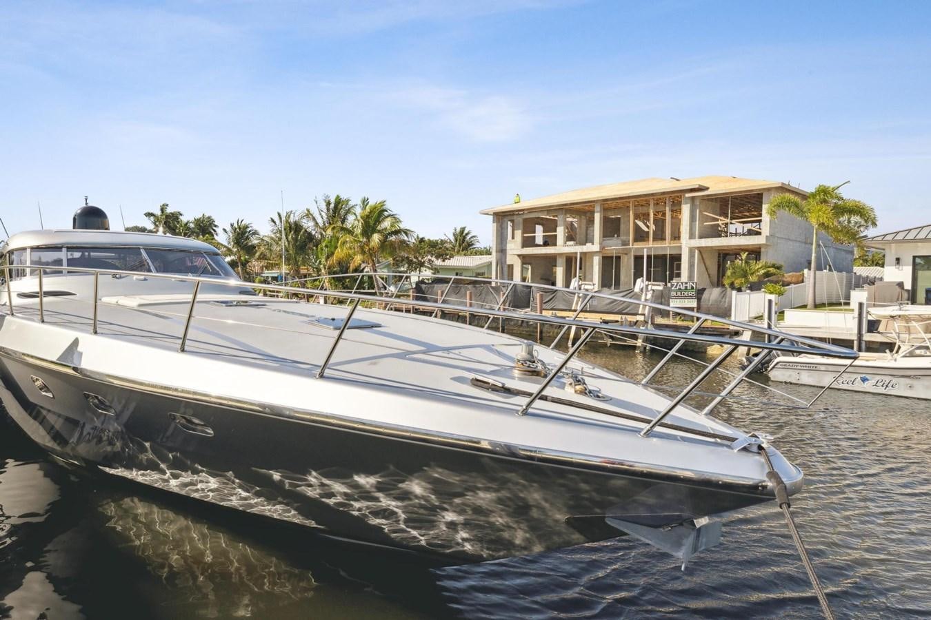 a boat docked at a pier aboard ALCHEMY Yacht for Sale