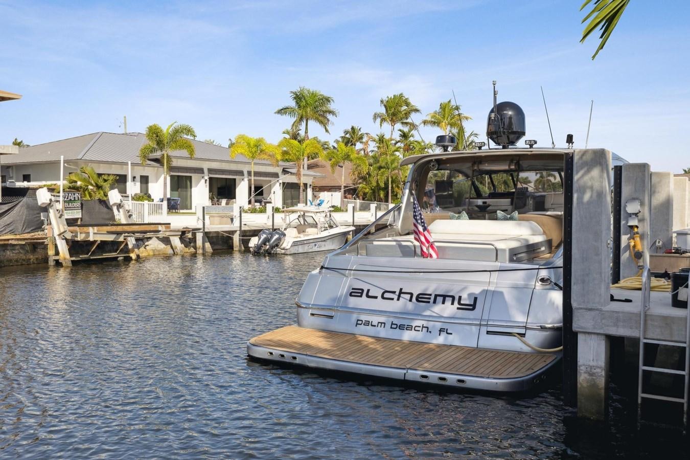 a boat docked at a pier aboard ALCHEMY Yacht for Sale