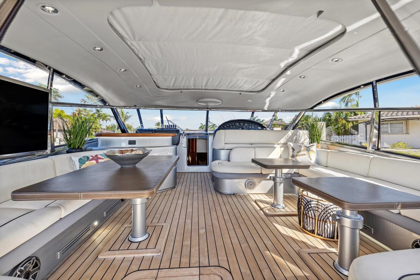 a room with a wood floor and a large window with a wood floor aboard ALCHEMY Yacht for Sale