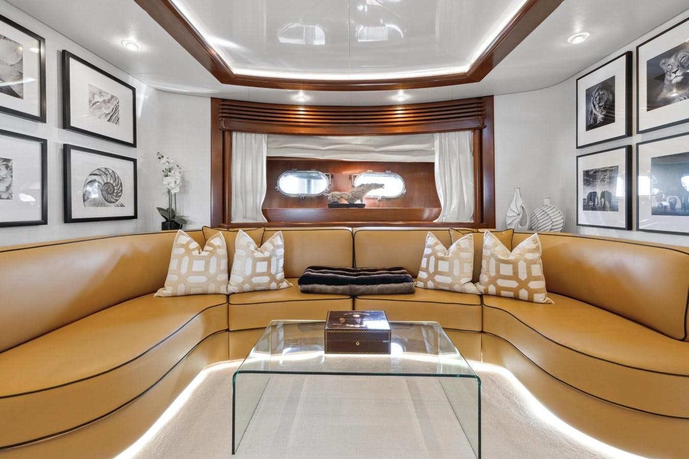 a living room with a couch and a table aboard ALCHEMY Yacht for Sale