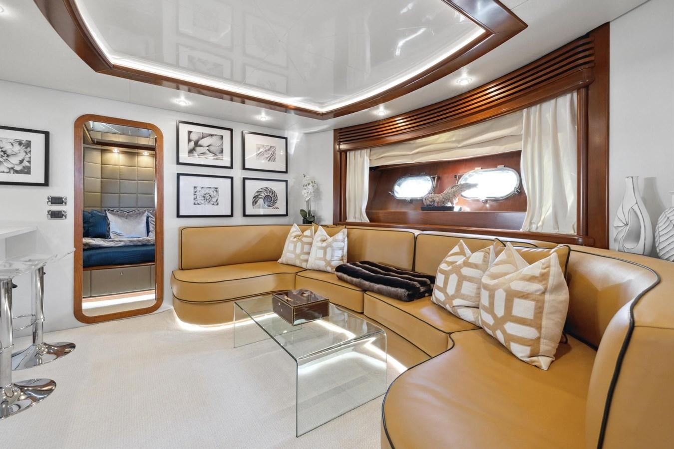 a living room with a large mirror aboard ALCHEMY Yacht for Sale