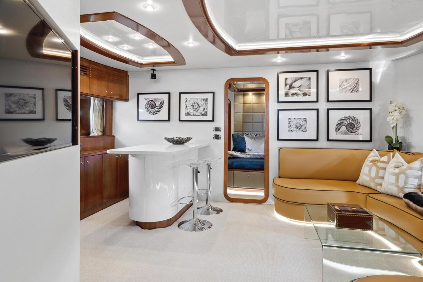 a living room with a large mirror aboard ALCHEMY Yacht for Sale