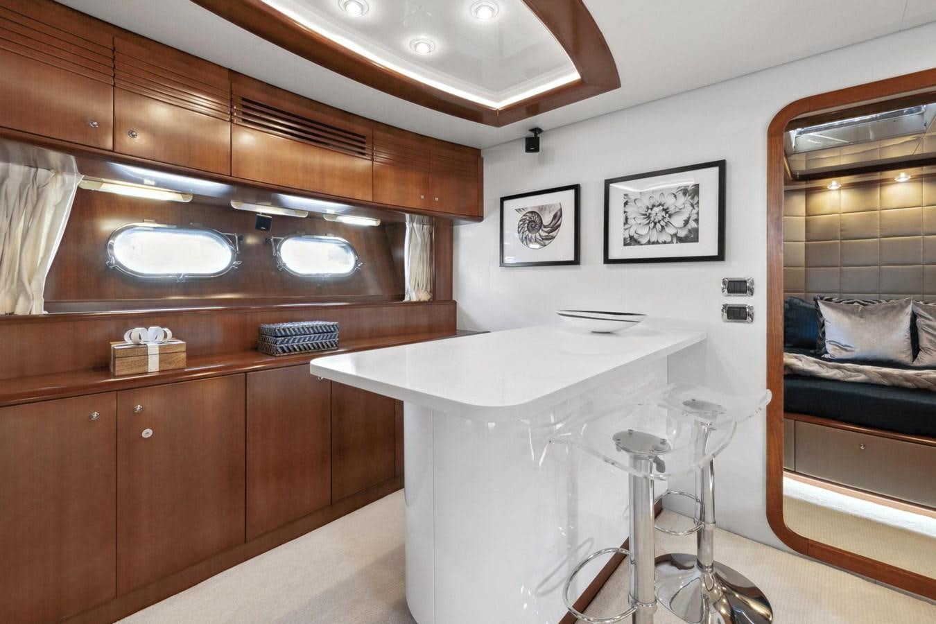 a kitchen with a table and chairs aboard ALCHEMY Yacht for Sale