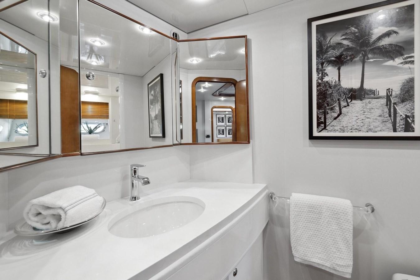 a bathroom with a large mirror aboard ALCHEMY Yacht for Sale