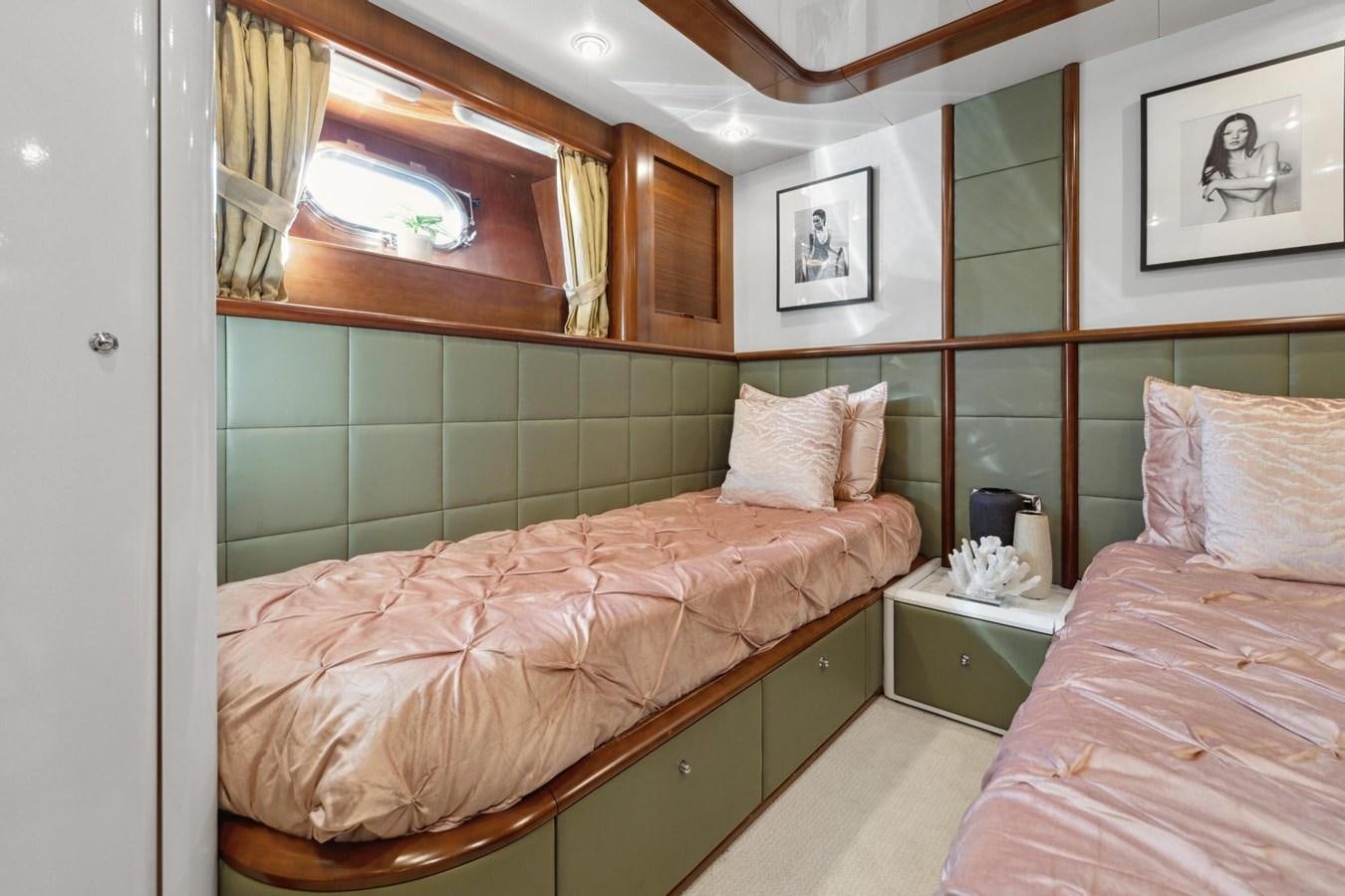 a couple of beds in a room aboard ALCHEMY Yacht for Sale