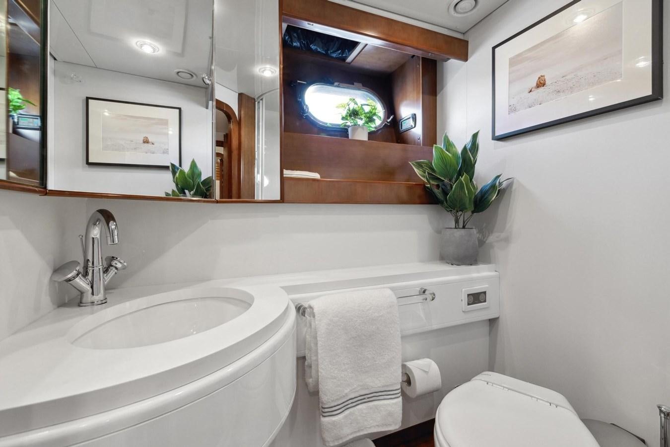 a bathroom with a sink and toilet aboard ALCHEMY Yacht for Sale