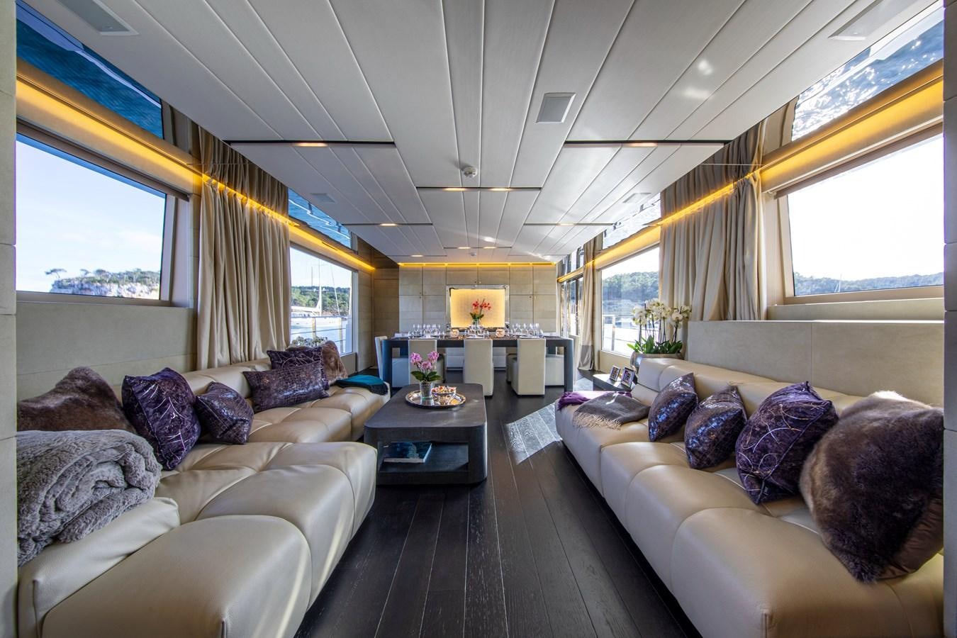 a living room with a couch and a table aboard CINQUANTA-50 Yacht for Sale