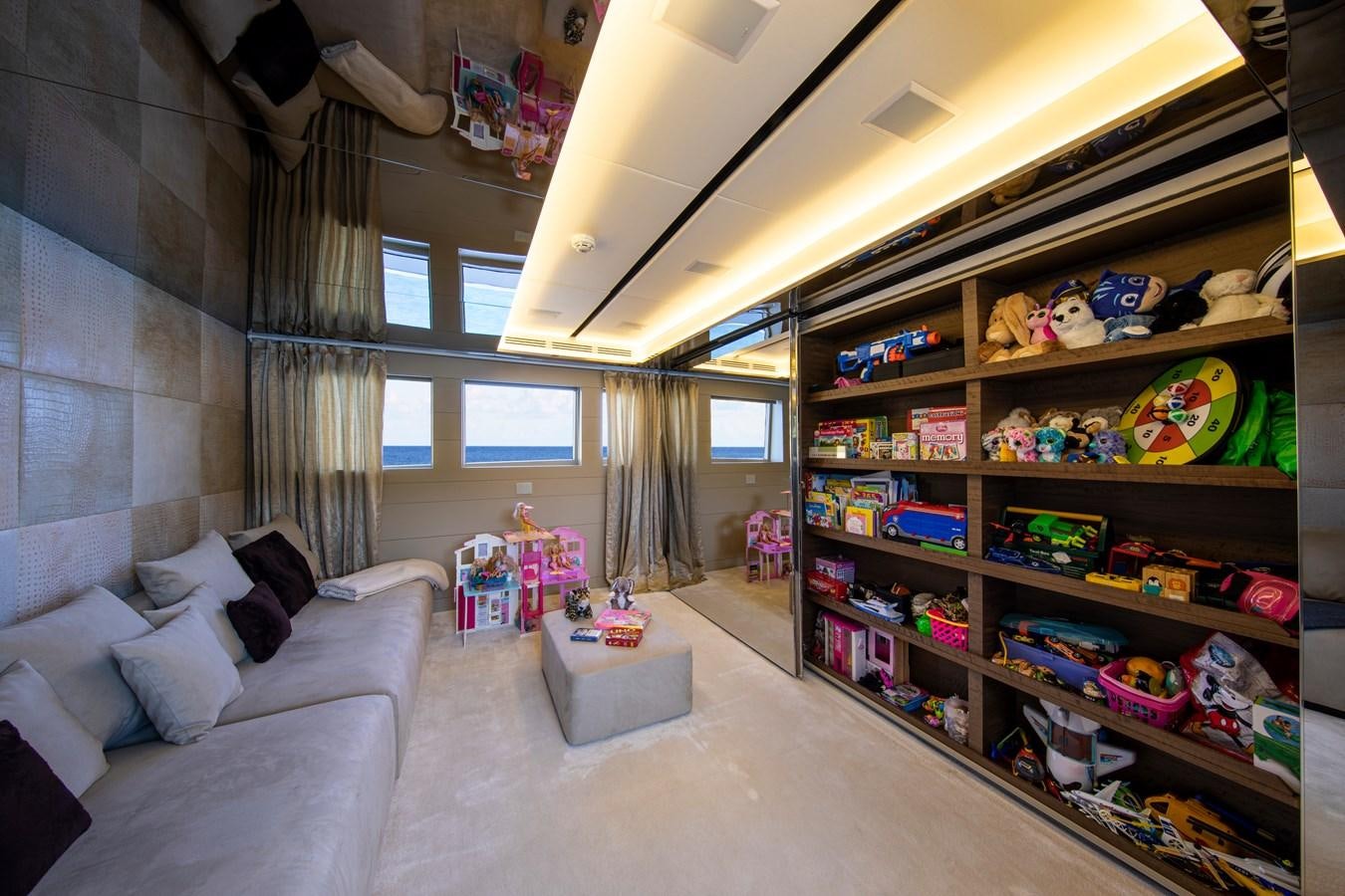 a room with shelves and a couch aboard CINQUANTA-50 Yacht for Sale