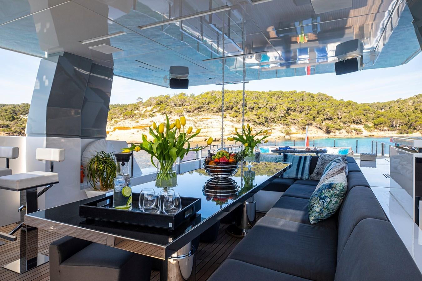 a living room with a couch and a table aboard CINQUANTA-50 Yacht for Sale