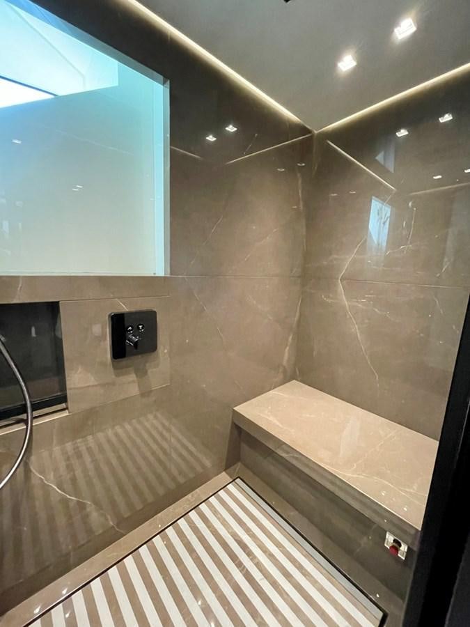 a bathroom with a large glass wall aboard TOGETHER Yacht for Sale