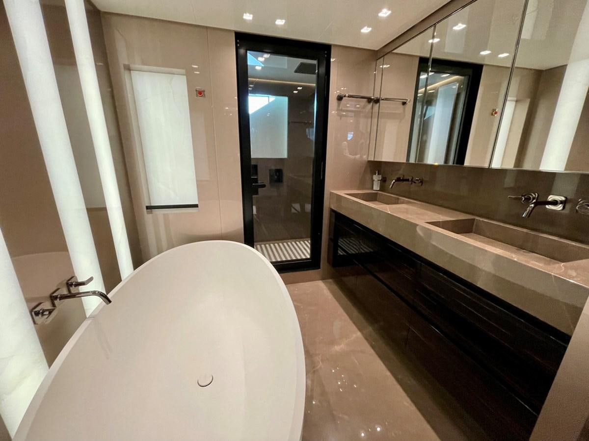 a bathroom with a bathtub and sink aboard TOGETHER Yacht for Sale