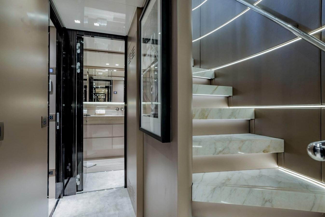 a room with a staircase and a glass door aboard TOGETHER Yacht for Sale