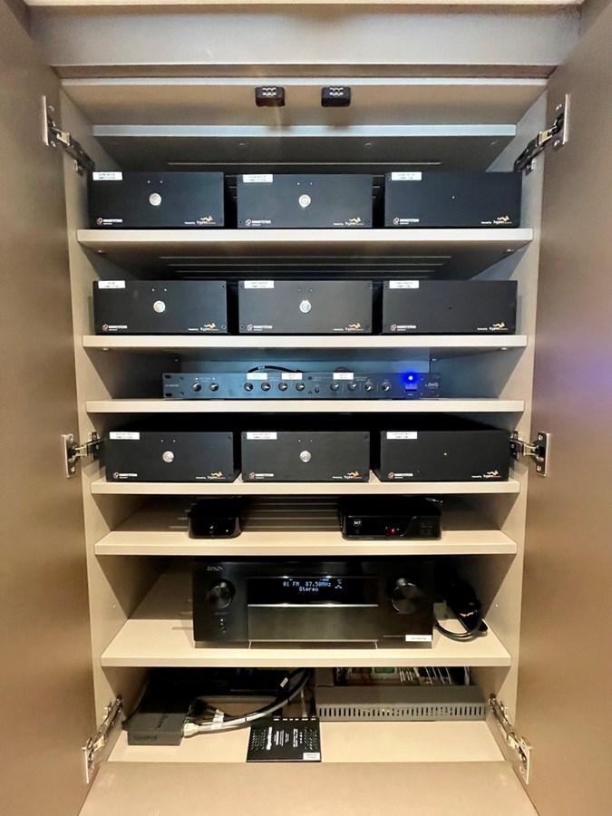 a shelf with electronics aboard TOGETHER Yacht for Sale