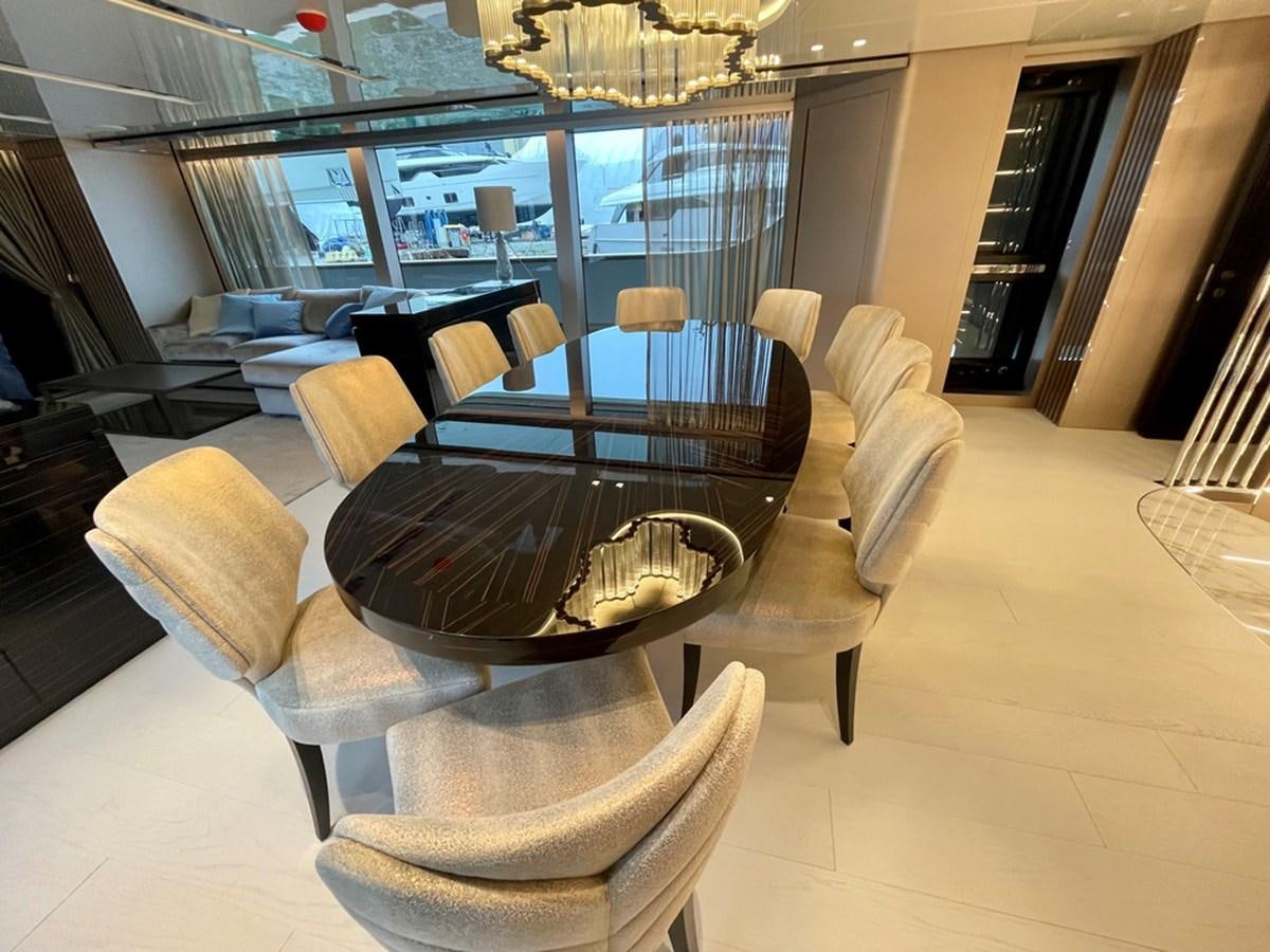 a room with a large table and chairs aboard TOGETHER Yacht for Sale