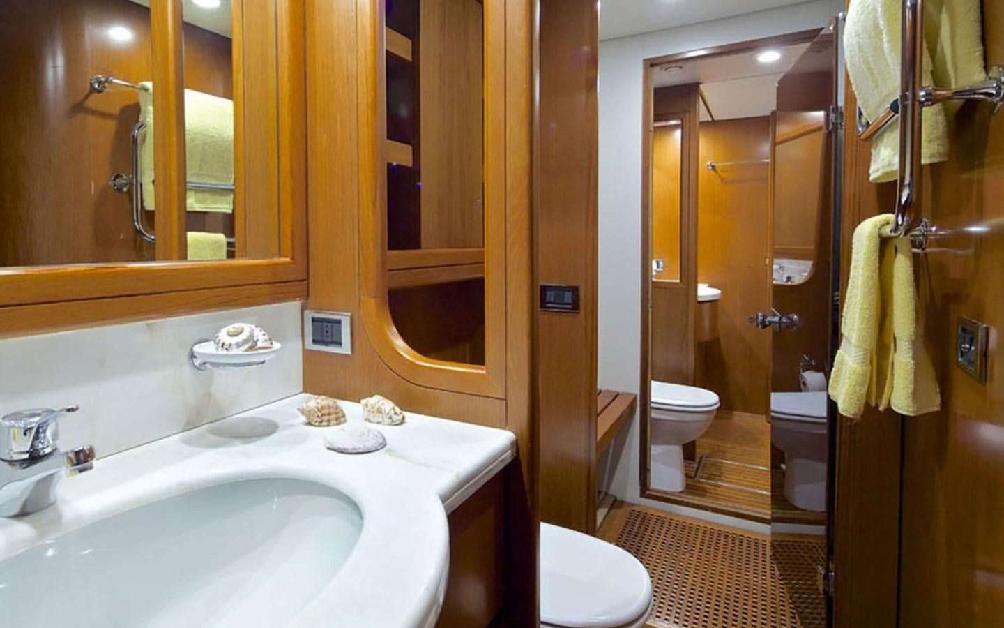 a bathroom with a sink toilet and a bathtub aboard AQUAJOY Yacht for Sale