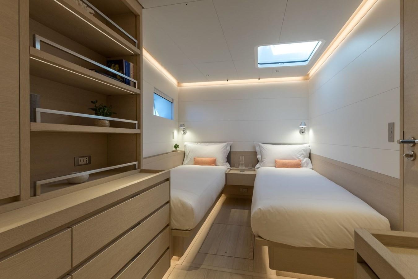 a room with a bed and a shelf aboard CERVO Yacht for Sale