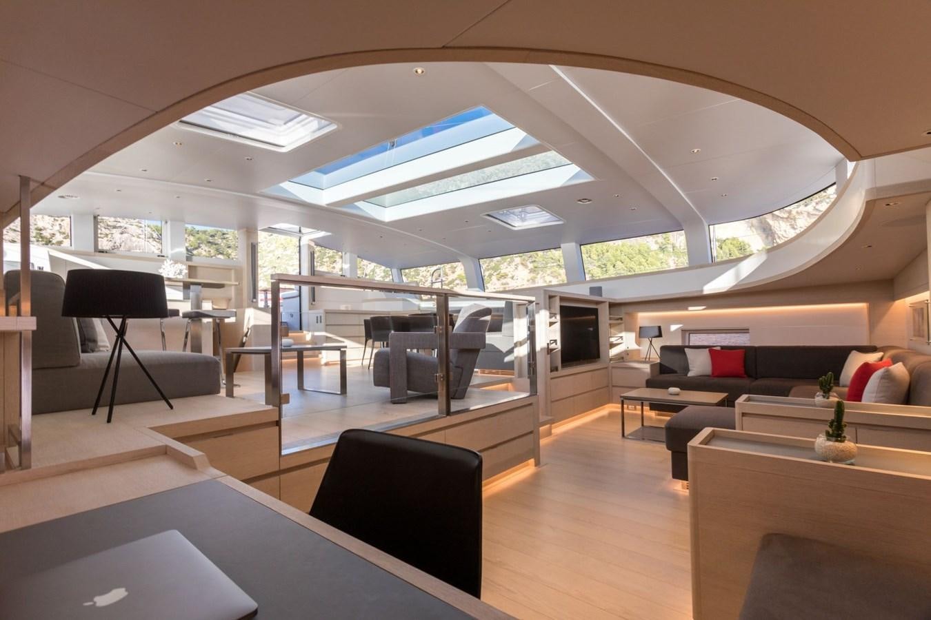 a room with a couch and a table aboard CERVO Yacht for Sale