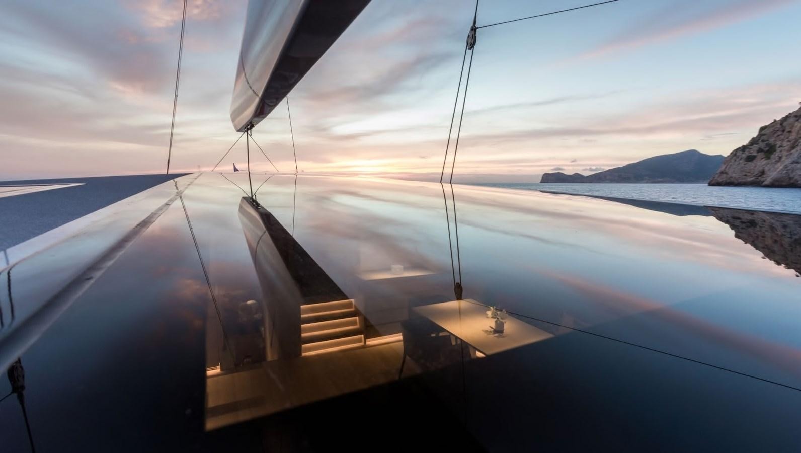a plane flying over water aboard CERVO Yacht for Sale