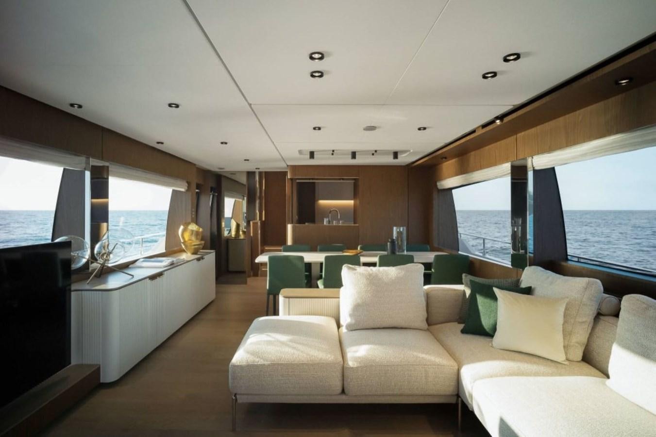 a living room with a large window aboard 5 PALMS Yacht for Sale