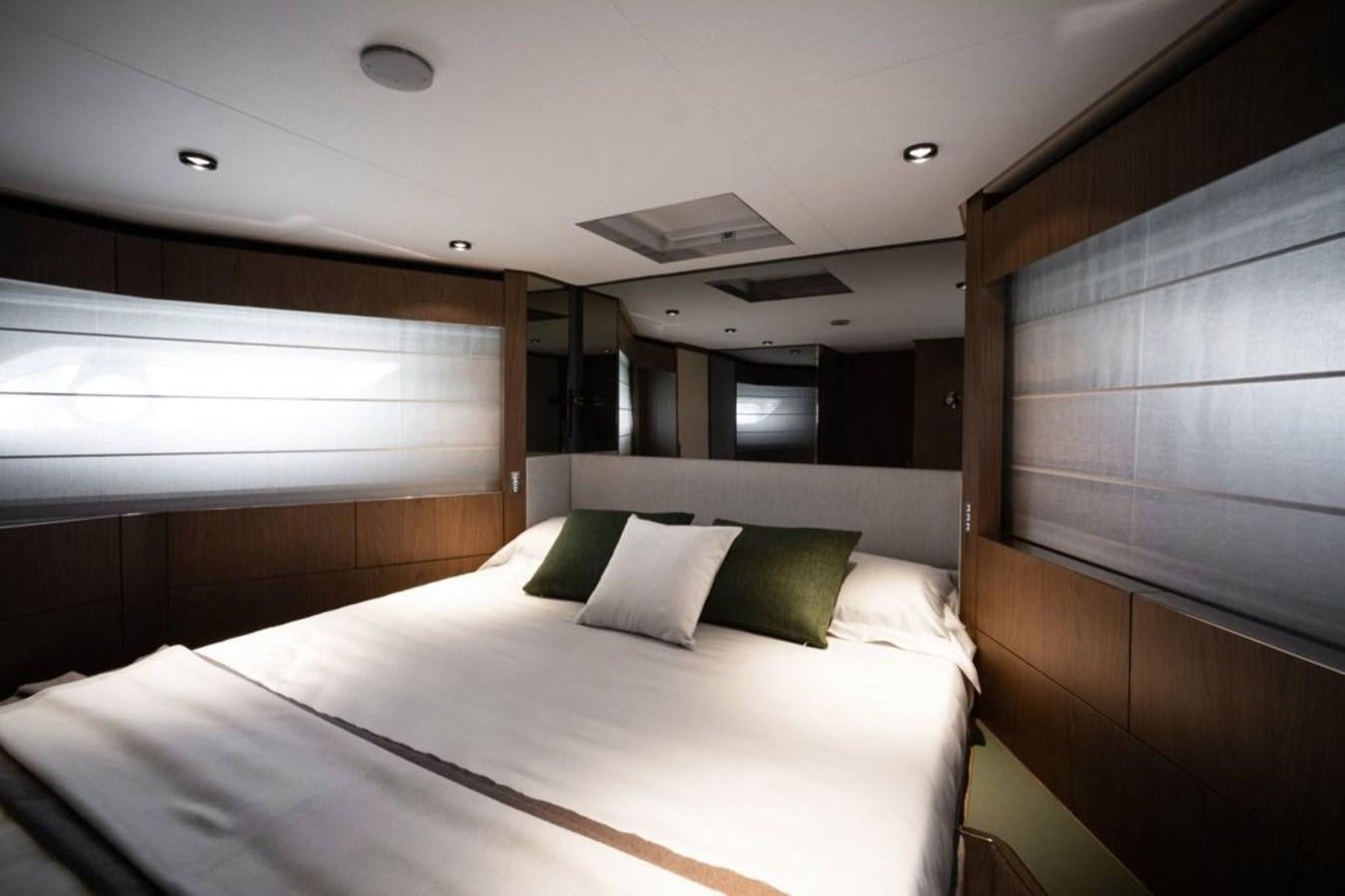 a bed in a room aboard 5 PALMS Yacht for Sale